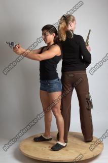 2021 01 OXANA AND XENIA STANDING POSE WITH GUNS (2)